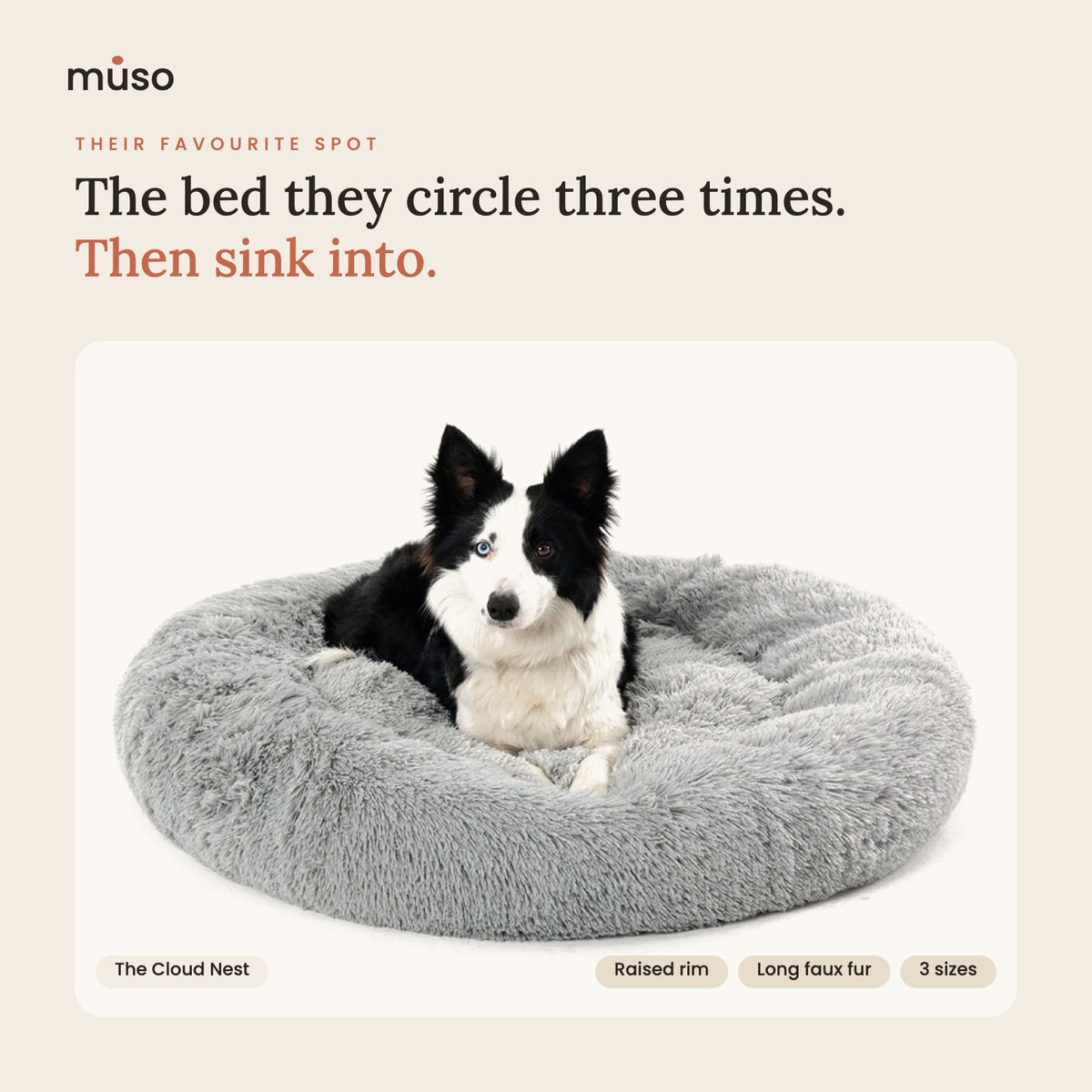 The Cloud Nest fluffy donut bed in Light Grey with a dog resting in it