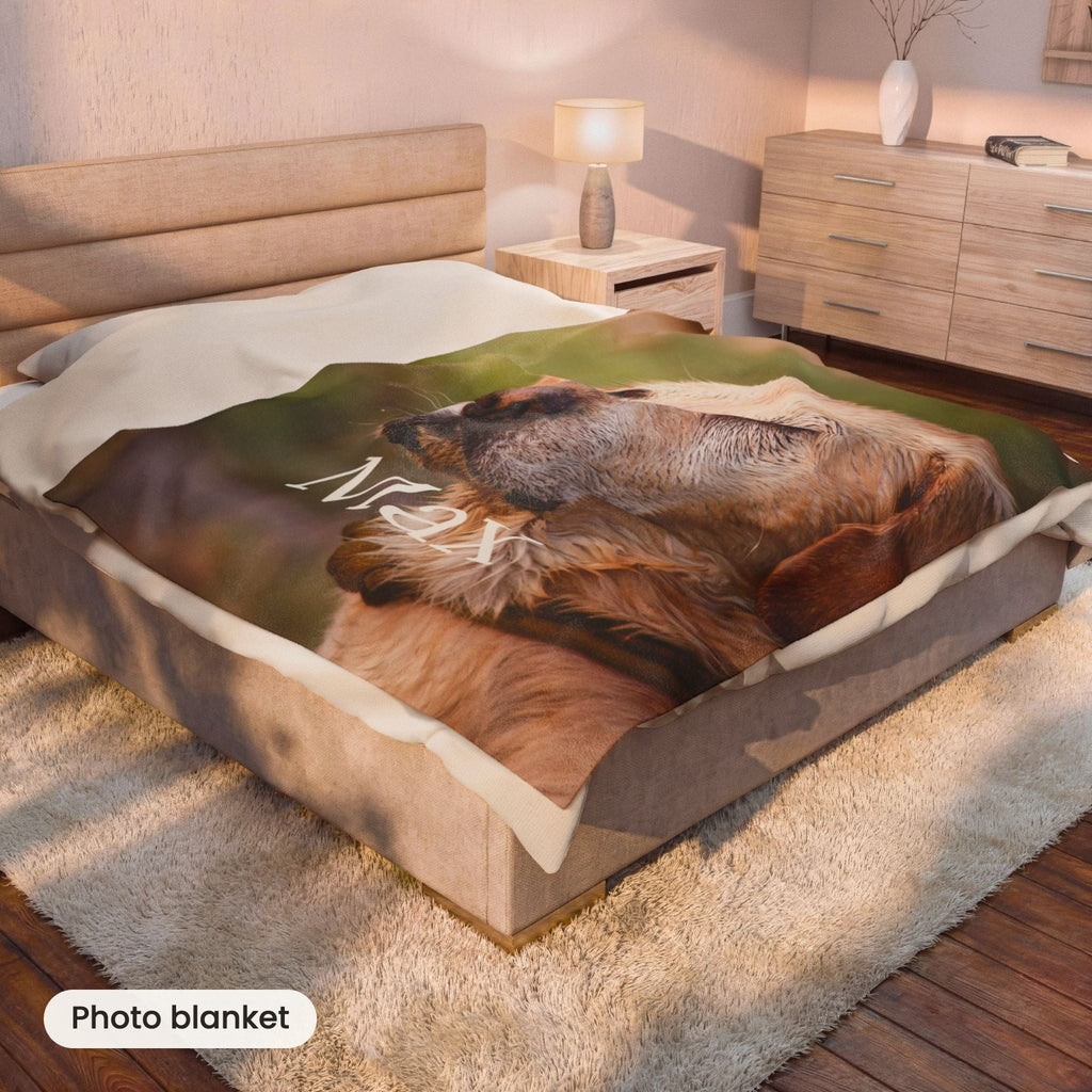 The Portrait Blanket with a dog's photo on a bed in a cosy bedroom
